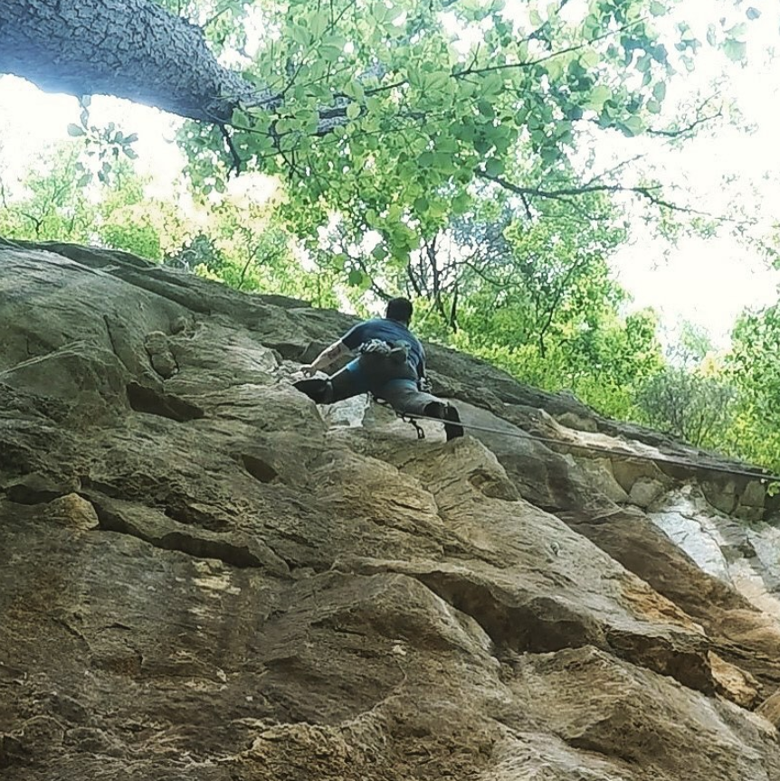 Joey climbing a route